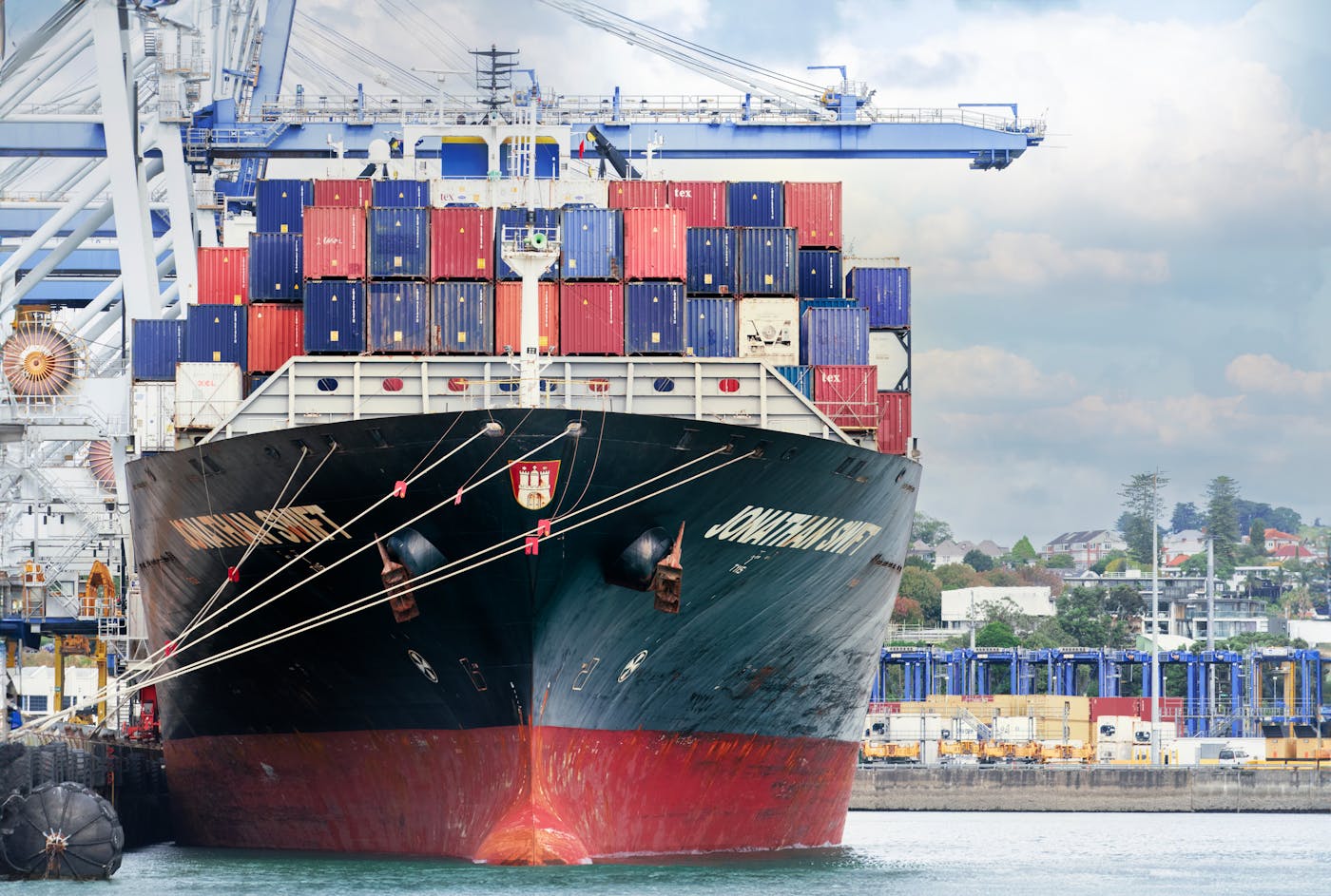Export shipping containers loaded on a cargo ship at an Indian port